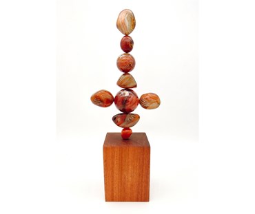 TOTEM 37 is entirely unique made from the following precious crystal stones:
From the top – This Totem is made entirely from Sardonyx Crystal Stones with one Carnelian at the base. The stones are supported on a central support sitting on a Sapele wood base.