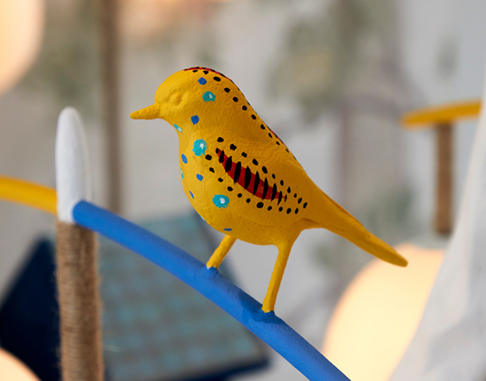 A crafted yellow bird sculpture