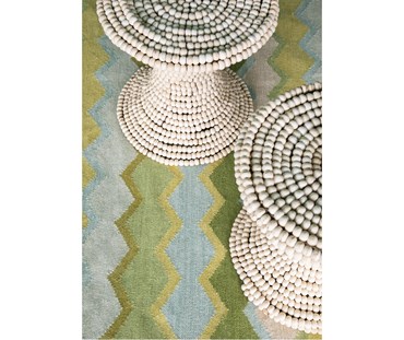 Close up shot of Safety Net green rug from Capsule collection