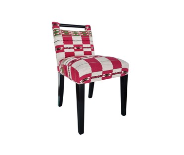 Kit Kemp's handle chair in the pink Chubby Check fabric for Christopher Farr