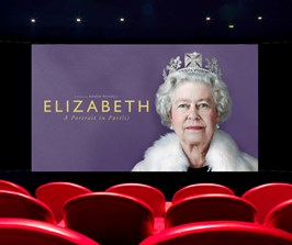 A cinema with a still from the film Elizabeth A Portrait in Paris showing on screen