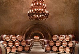 Barrels in the wine caves in far niente's estate in napa valley