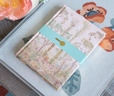 B5 notebook on an acrylic tray featuring tall trees design
