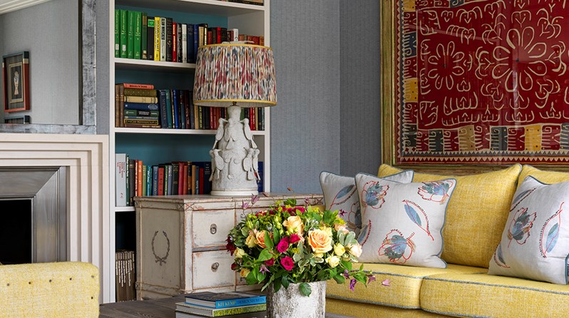 A sofa, coffee table and large 'Hot Line' rug from the Kit Kemp for Annie Selke collection is pictured in The Terrace Suite at Ham Yard Hotel