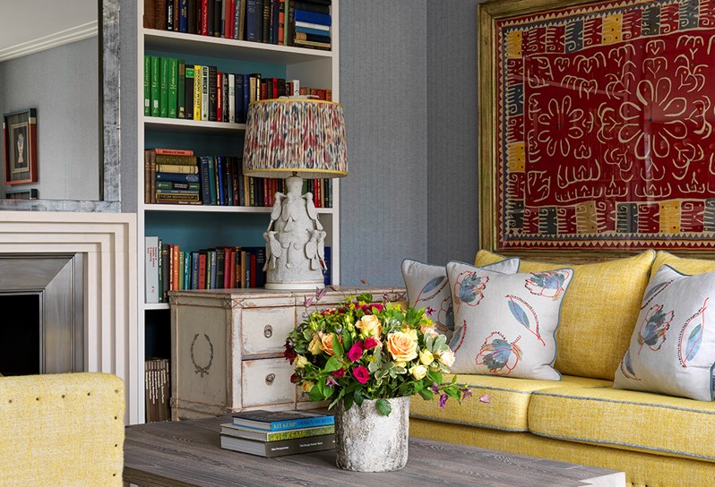 A sofa, coffee table and large 'Hot Line' rug from the Kit Kemp for Annie Selke collection is pictured in The Terrace Suite at Ham Yard Hotel