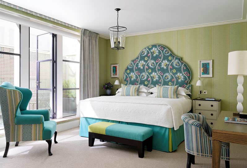 The bedroom area with outdoor terrace in a One Bedroom Apartment at One Denman Place