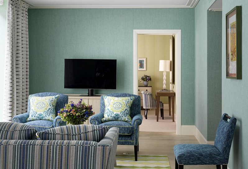 A seating area with outdoor terrace in a One Bedroom Apartment at One Denman Place