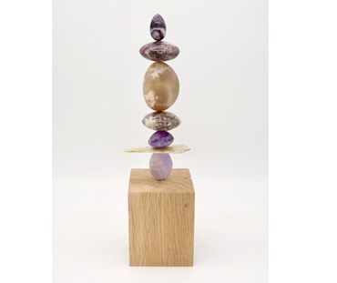 TOTEM 47 is entirely unique made from the following precious crystal stones:
From the top – Amethyst, Lepidolite, Flower Agate, Lepidolite and 2 Amethyst. The stones are supported on a central support sitting on an oak base.