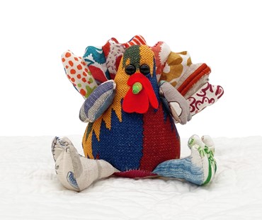 Our Shades of Autumn limited edition run of the "Timothy Turkey" patchwork toy, uses assorted re-purposed fabric, in various prints and textures to colours inspired by an autumn trees, from greens, yellows , reds and rust browns. Each handmade toy is individual. This one has a rich rust and blue body, and a fan like tail of assorted orange toned fabrics.
Size when sitting:15cm x10cm