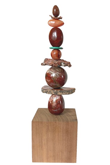 TOTEM 73 is entirely unique made from the following precious crystal stones:
From the top – Brown goldstone, raw copper ore, carnelian, mahogany obsidian, malachite disk, carnelian sphere, raw copper ore, petrified wood sphere, petrified wood slice and a petrified egg form. The stones are supported on a central support sitting on an sapele wood base.
Size H45cm W13cm D10cm includes base