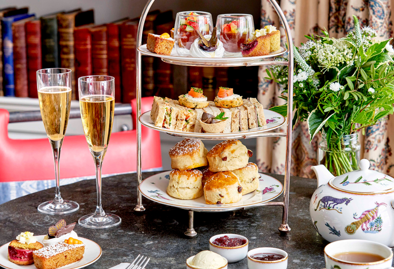 A Champagne Afternoon Tea with nature themed sweet cakes and savoury pastries
