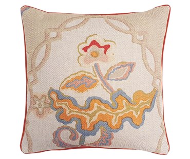Kit's chainstitch fabric cushion, with simplified floral design in soft coral orange, pale blue , and mustard tones, on a natural woven fabric ground. with contrasting coral piping.
