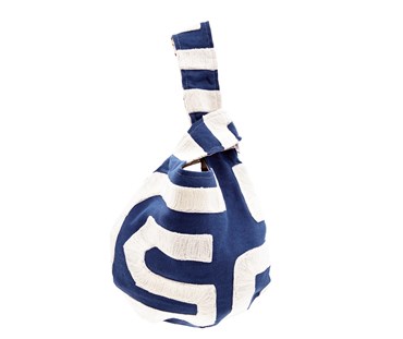 The Swirl Loop Bag is made out of cobalt blue cotton with wide ecru bands of crewelwork stitching forming loops and stripes, in this bold abstract design, and is lined in "Tea Leaves",
in sage green and ecru, resulting in this unique reversible bag.