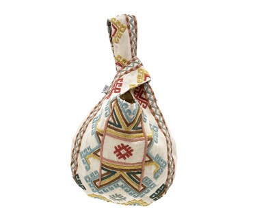 Outer view of the Ashen-wood Loop Bag is made out of linen based fabric which is hand embroidered with an "ikat" inspired design in soft blue, green, pink and yellow wool, and lined in "Tea Leaves", with it's taupe and white colourway, resulting in this unique reversible bag.