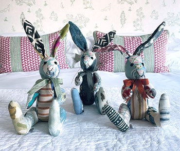 Our Minnie Rabbit, is a patchwork toy, which utilises the offcuts of the amazing fabrics utilised by Kit's design studio to make these unique and interesting patchwork toys, with their beautiful fabric and colour combinations. This limited edition run for spring are a combination of fabrics and colours on a natural ground, of blues, and pastel pinks, with highlights of contrasting colours and textures.
