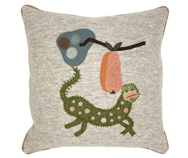 A large grey wool cushion with mythical green gherkin basking under an orange pear, hanging from a tree's branch is hand appliqued in a variety of wool fabrics, on this stunning cushion.