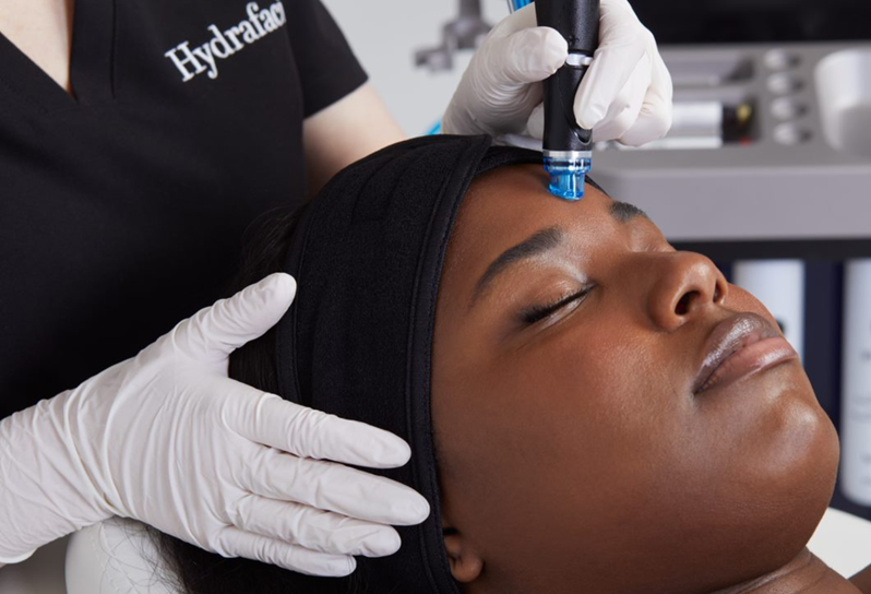A person receiving a HydraFacial treatment