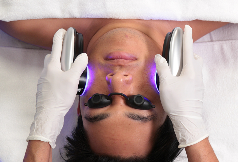 A person receiving a HydraFacial treatment