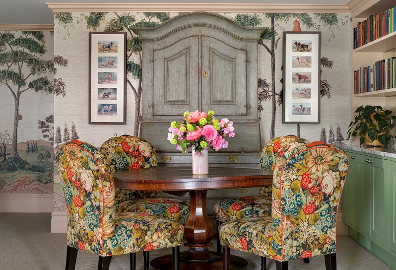 An antique bureau and dinning table in the Loft Suite at Covent Garden Hotel