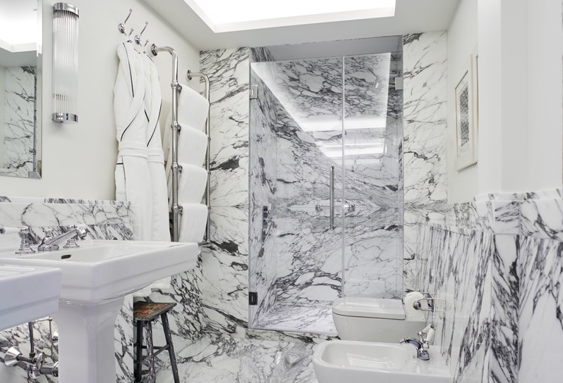 The bathroom with walk-in shower in the Meadow Suite at Crosby Street Hotel