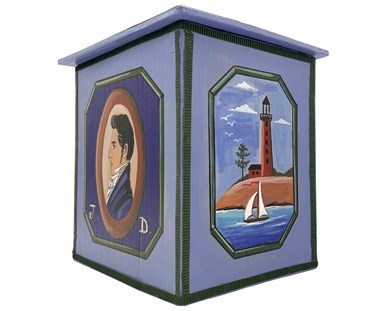 The side view of the "Admiral" box, is decorated with a illustration of an 18th century gentleman, on the front , and a brown lighthouse view illustrated on the side of this tall cornflower blue box.