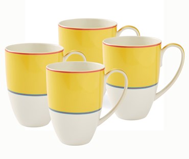 The set of 4 Yellow Calypso Mugs , which are large white mugs, with a wide yellow bands, bordered by narrow central stripes in pink and blue, and tipped with a pink outer bands. Sold in sets of 4, these mugs are a handful of warmth to all the senses.