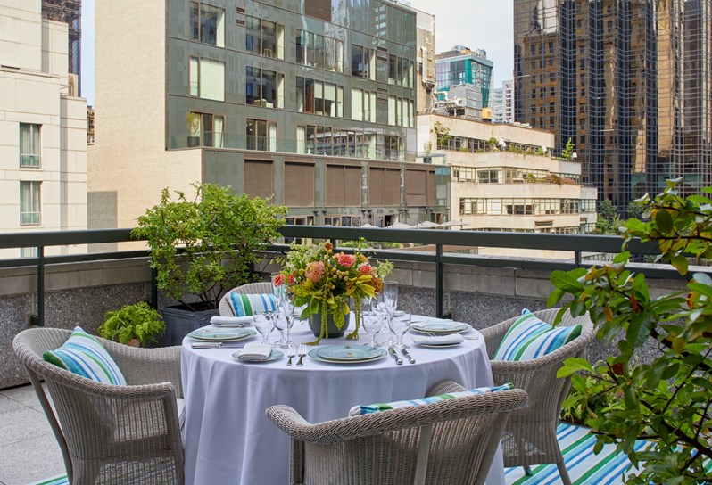 An outdoor terrace overlooking Midtown Manhattan at The Whitby Hotel