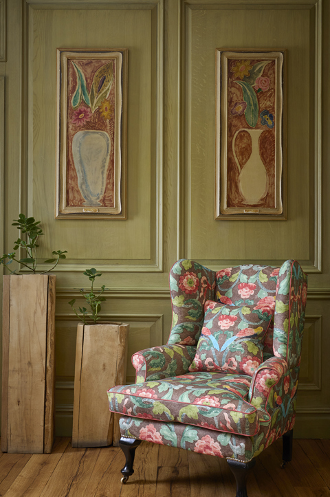 A patterned wing chair in the Library at Charlotte Street Hotel