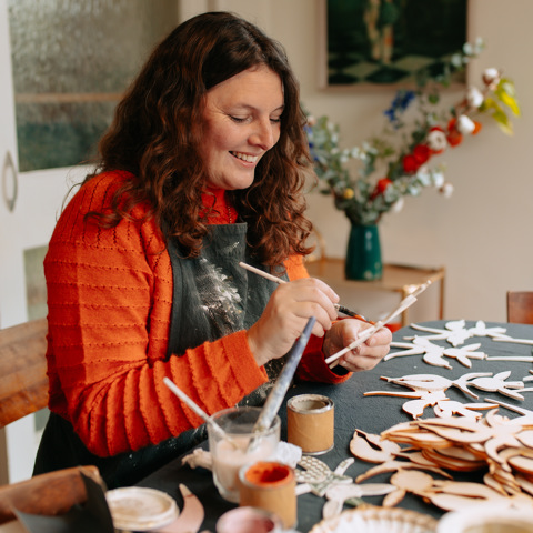 Alice Mary Lynch painting Christmas decorations