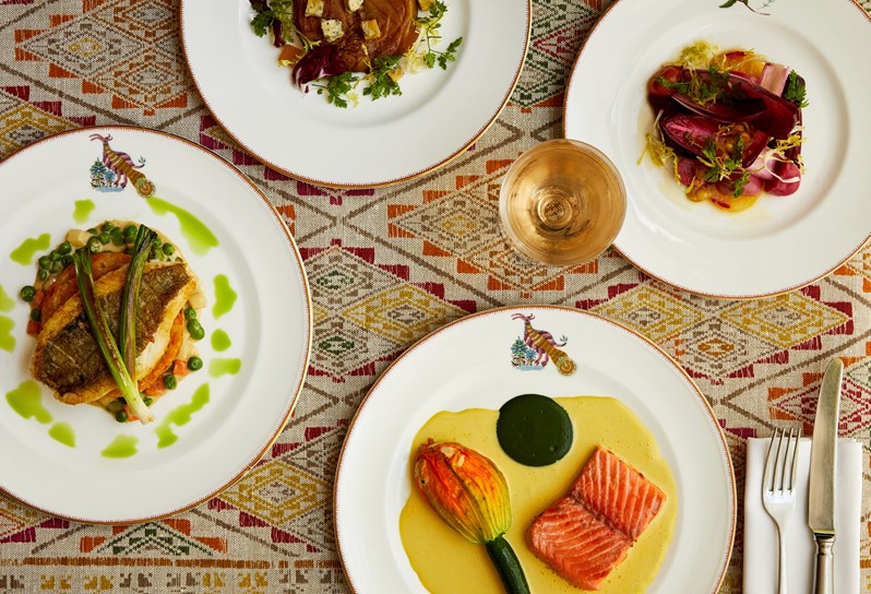 An image of multiple dishes, including multiple fish dishes, from the A La Carte Menu at Refuel, Soho Hotel.