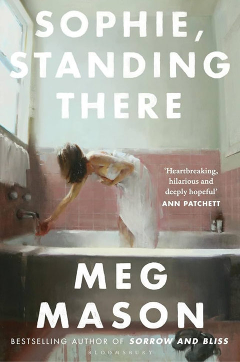 The cover of the book Sophie, Standing There by Meg Mason featuring a girl wrapped in a towel standing in a bath 