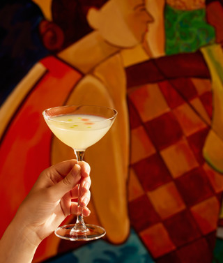 A close-up wide angle shot of the 'Mural You Look' cocktail from the Bloomsbury Group cocktail collection at Oscar Bar & Restaurant