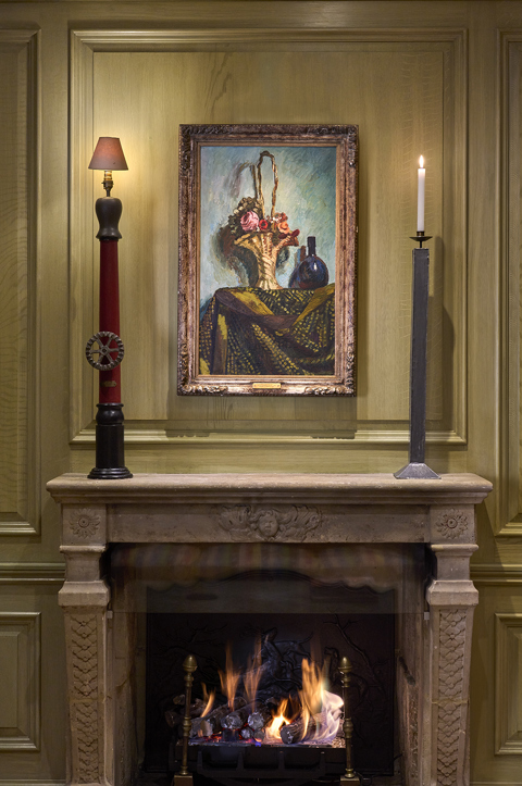 A Close up shot of the fireplace in the Library at Charlotte Street Hotel
