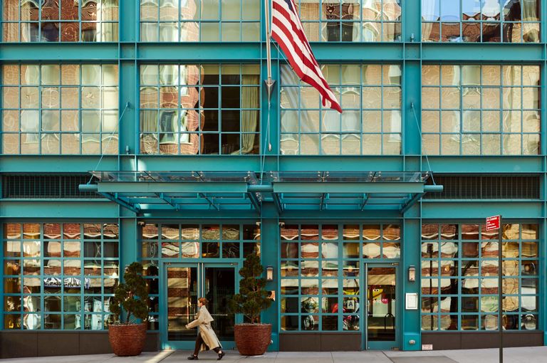 A close up shot of the entrance of the Warren Street Hotel, with the flag.