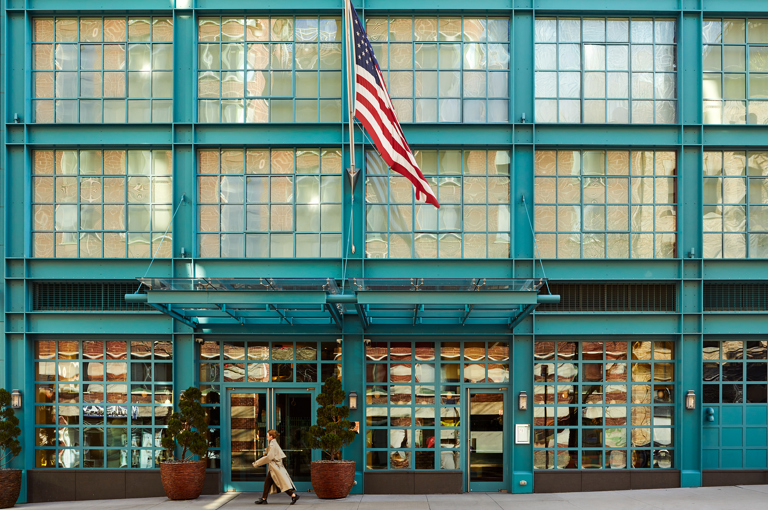 A close up shot of the entrance of the Warren Street Hotel, with the flag.