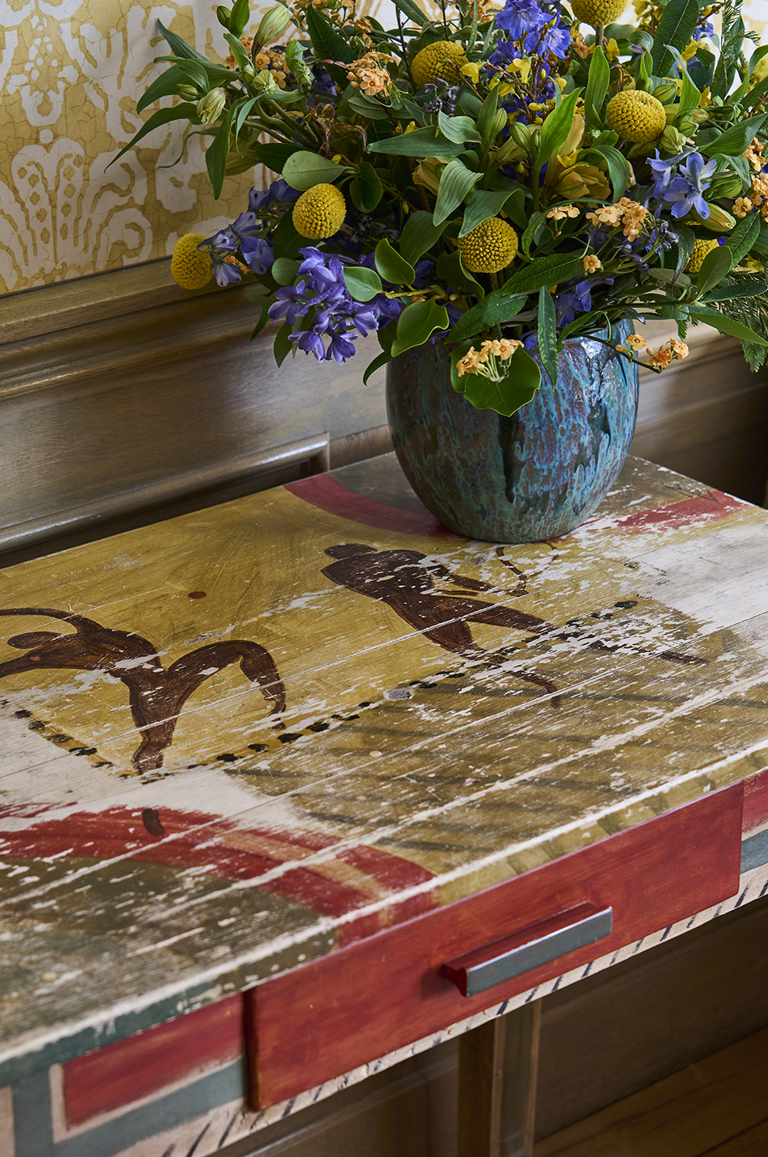A handpainted desk at Charlotte Street Hotel depicting abstract figures playing tennis