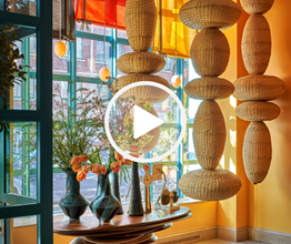 A hanging sculpture featuring a series of woven shapes