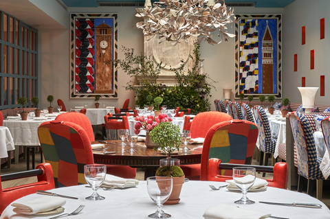 Close up round and long dining tables set-up in the Orangery private events room at Warren Street Hotel