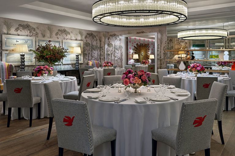 Round dining tables set-up in the Prince private events room at Crosby Street Hotel
