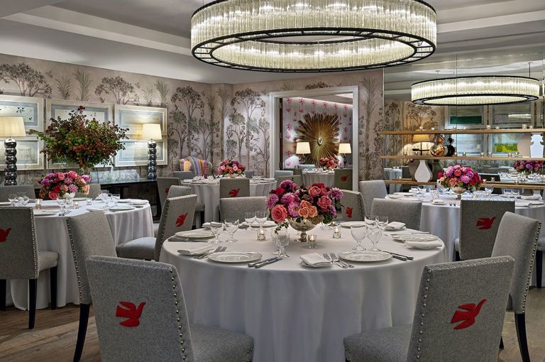 Round dining tables set-up in the Prince private events room at Crosby Street Hotel