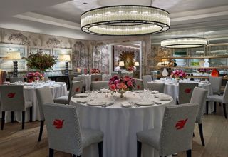 Round dining tables set-up in the Prince private events room at Crosby Street Hotel