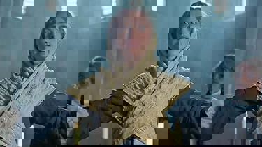 A still from the film "Testament Of Ann Lee" showing the main character.