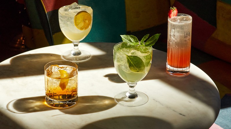 A shot of multiple cocktails on a table at Warren Street Hotel.