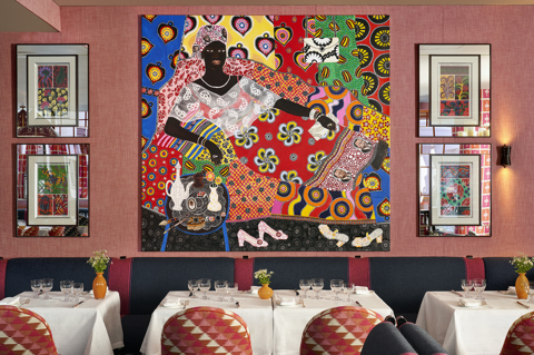 Side shot of Brumus Restaurant artwork and dining tables at Haymarket Hotel