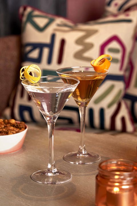 Close portrait shot of two Martini cocktails and bar snacks at Brumus