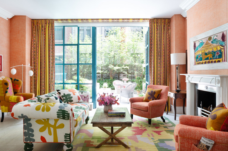 A wide shot of the sitting area opening onto the terrace in The Garden Suite at Warren Street Hotel