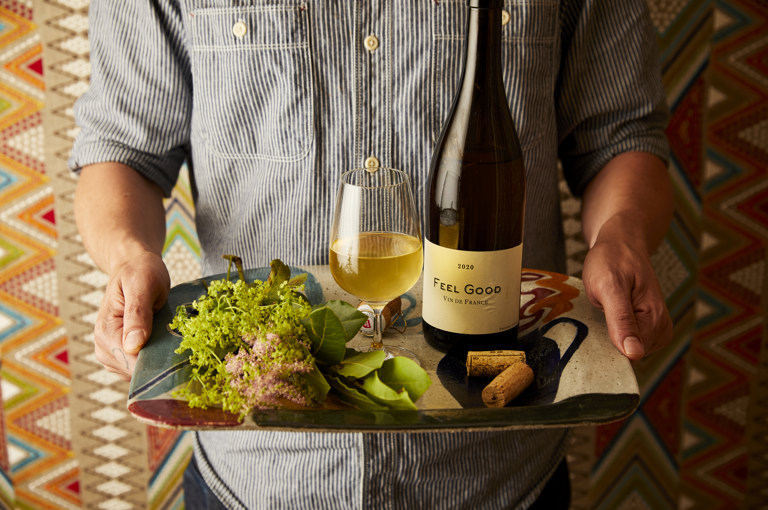 Wine Dinners at Covent Garden Hotel, a man holding a tray of wine