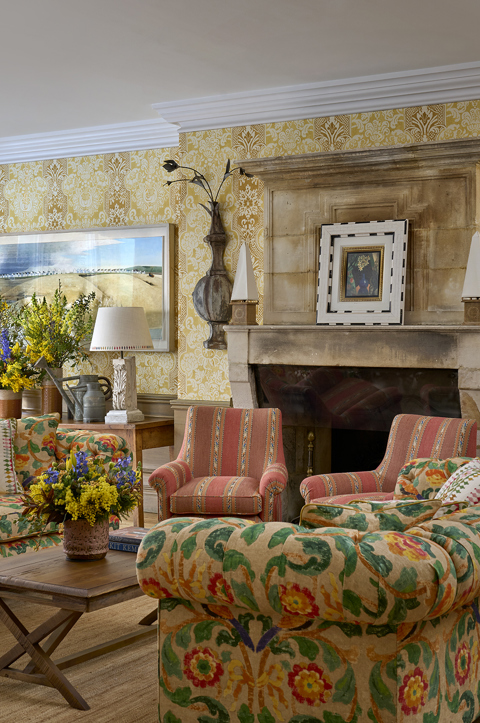 Diagonal shot of Drawing Room at Charlotte Street Hotel, showing two sofas and flowers.