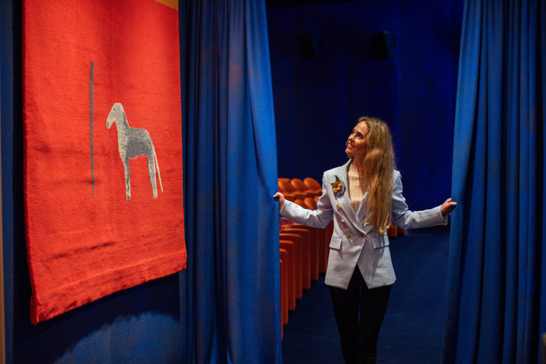 Willow Kemp stands next to the entracnce to the screening room at The Whitby Hotel