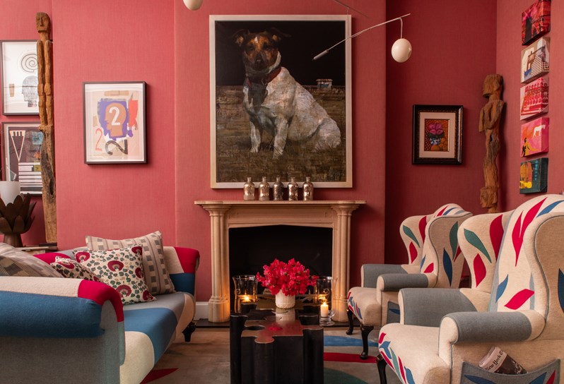 Close up image of the seating area around the fireplace at Crosby Street Hotel.